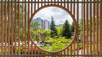 The moon window in the pavilion frames views of the landscape.